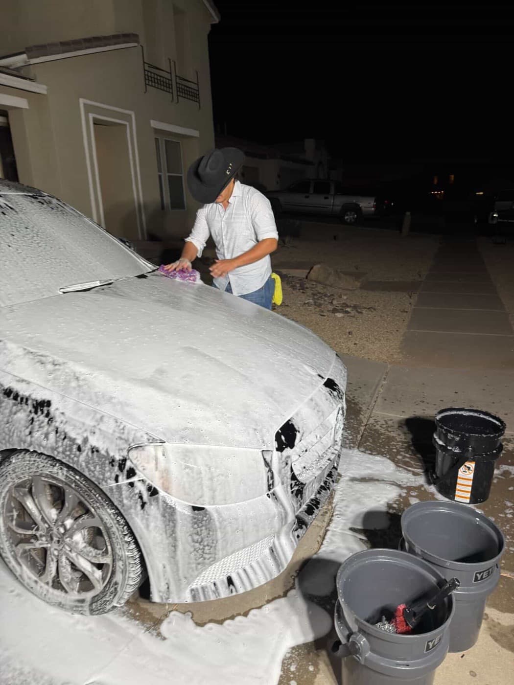 Macked Detailing owner working on a car in Tucson Arizona