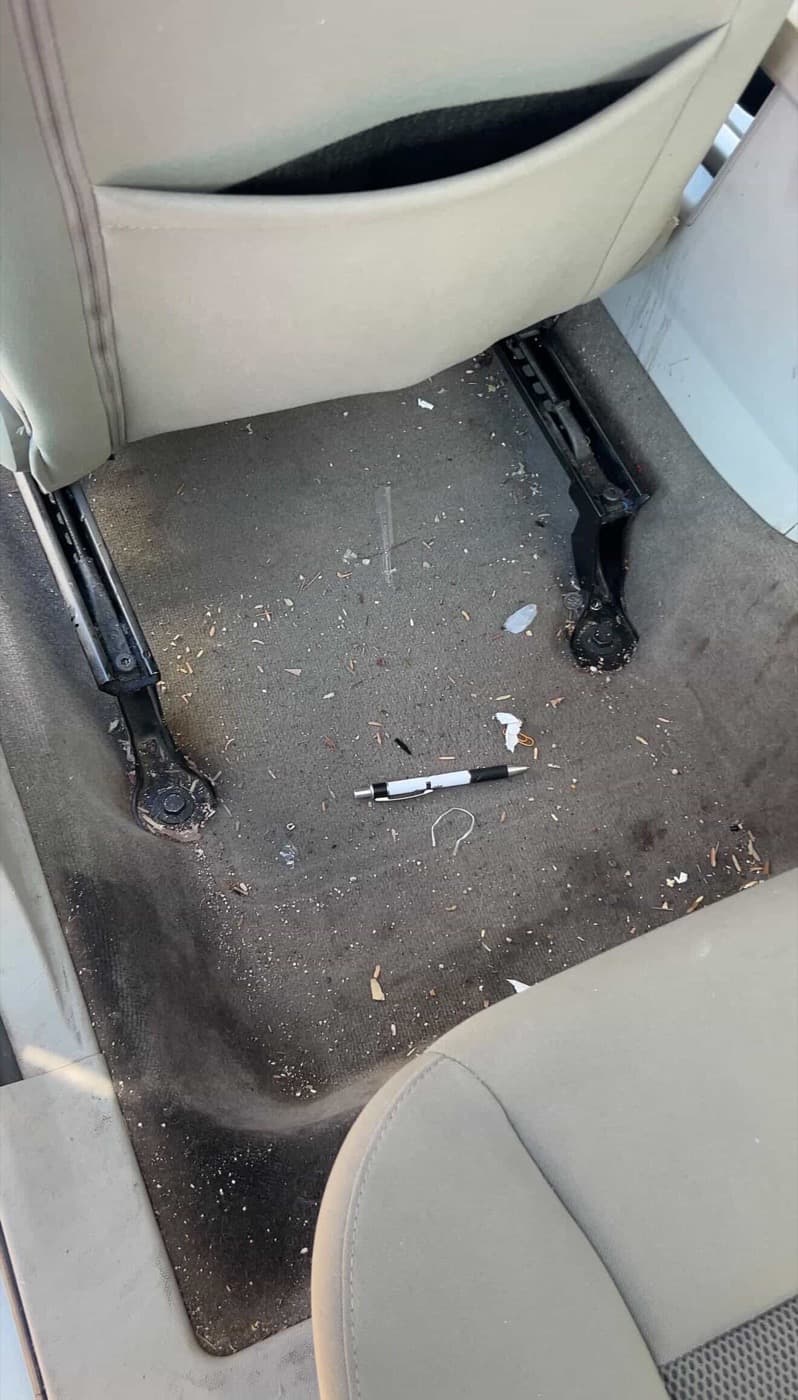 Car floor before detailing — debris and dirt
