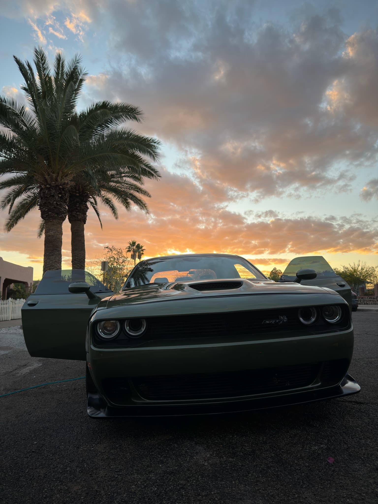 Black Dodge Challenger rear detail at sunset — mobile car detailing Tucson AZ