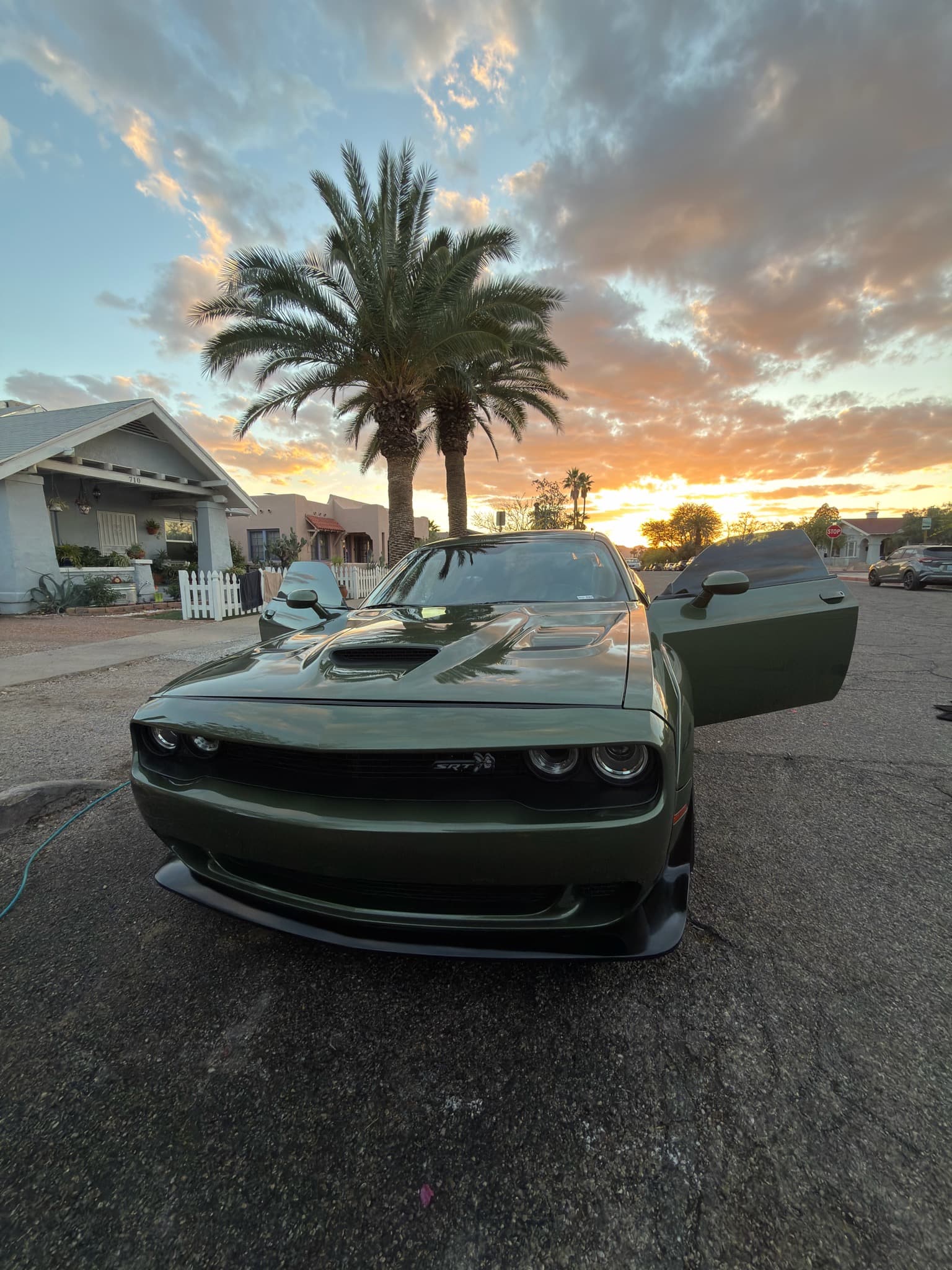 Black Dodge Challenger side profile after exterior detail — Tucson AZ